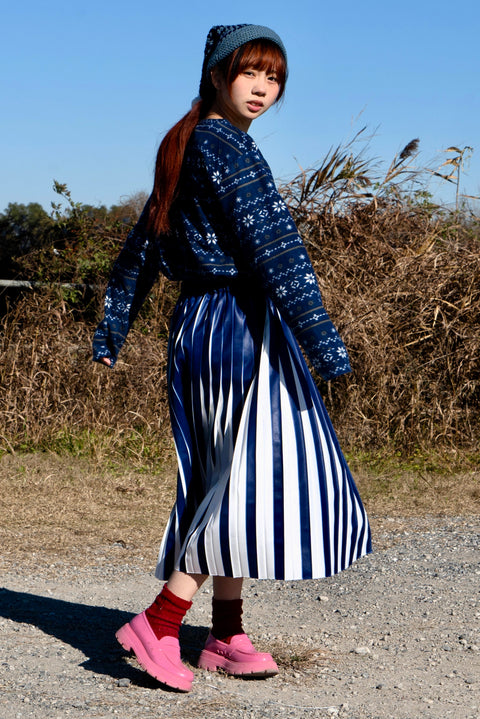 REVEAL PLEATS SKIRT