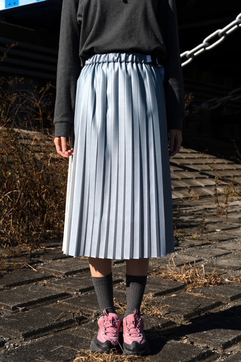 REVEAL PLEATS SKIRT